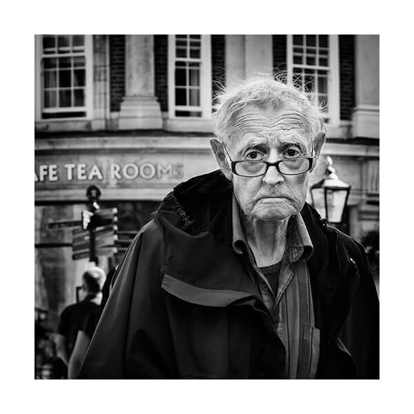 A black and white photo of an old man.