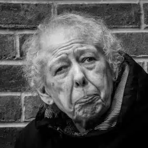 A black and white photo of an older woman.