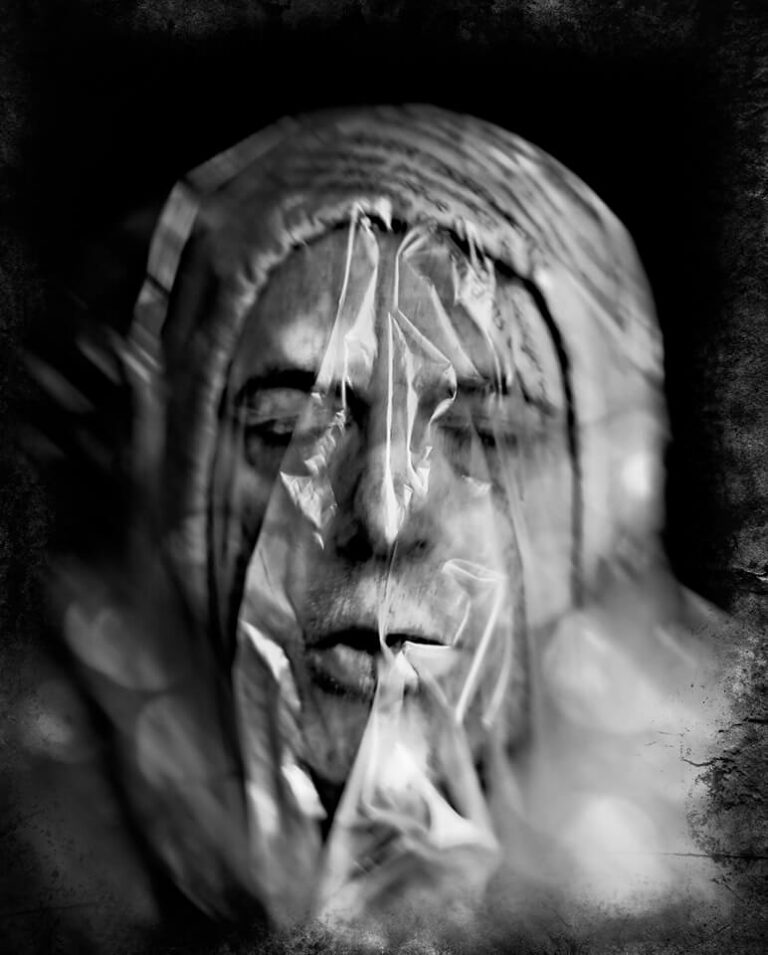 CT6 A black and white photo of a person covered in plastic.