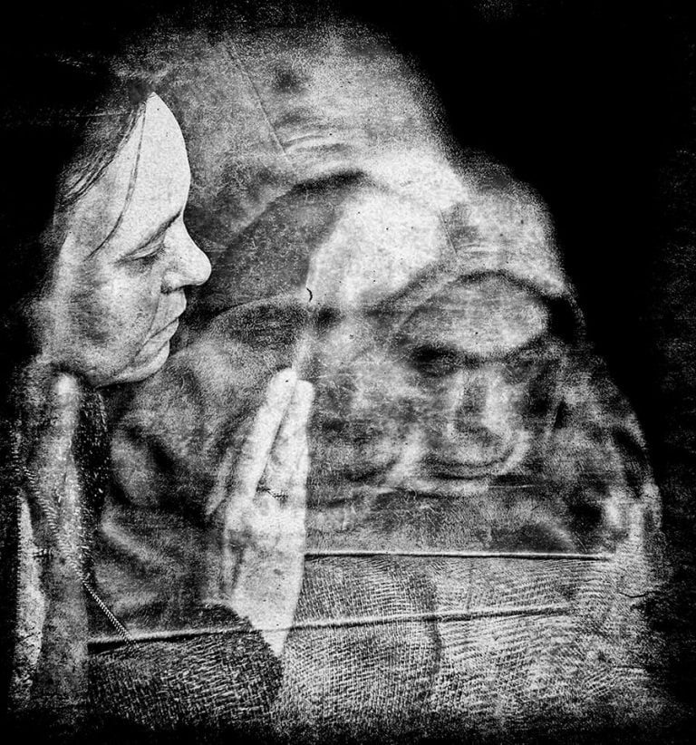 ct7 A black and white photo of a woman praying.