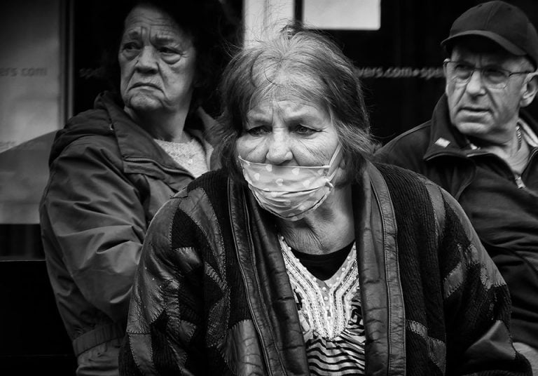 Photographs of the coronavirus lockdown-11 A black and white photo of an elderly woman wearing a face mask.