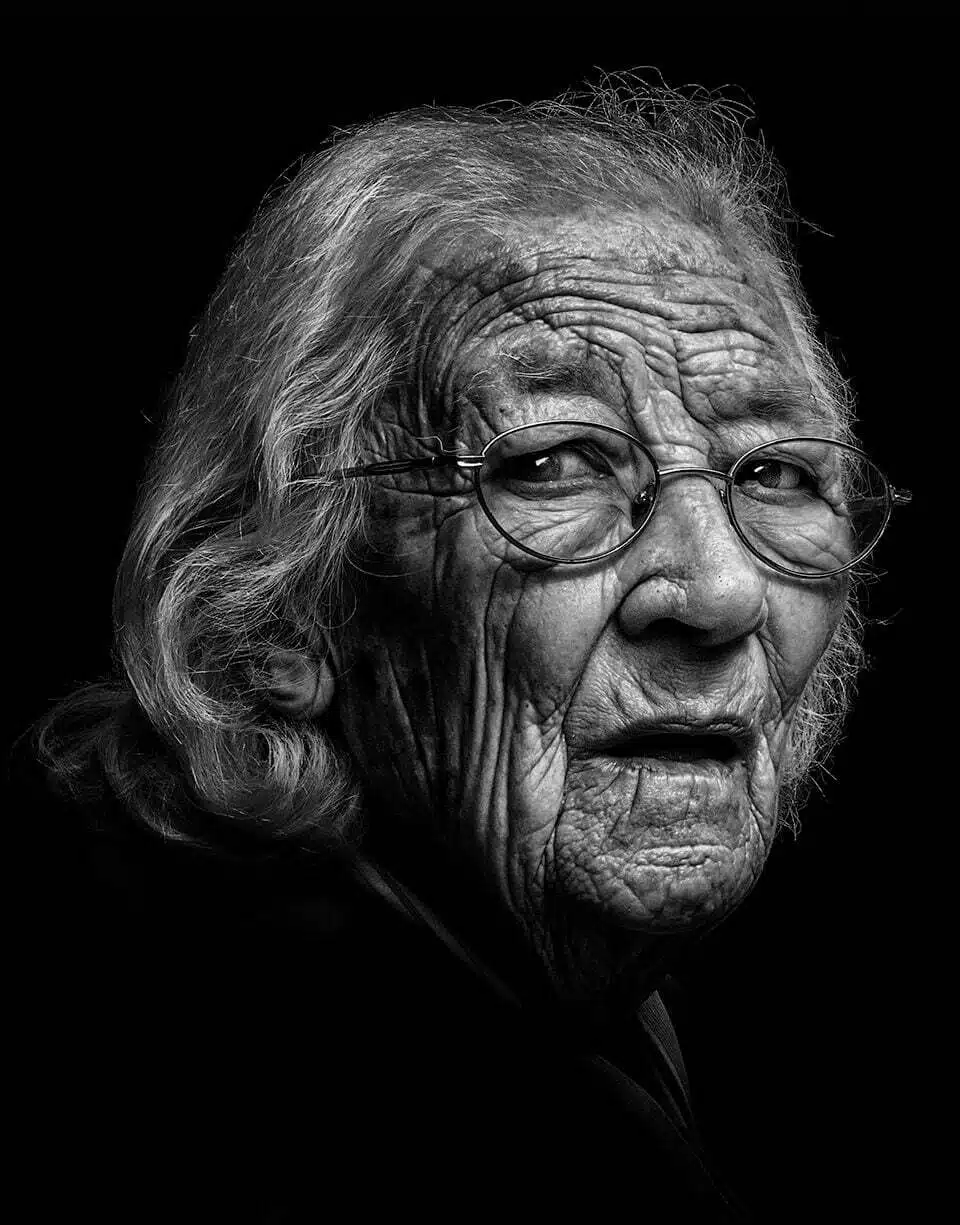 A black and white photo of an old woman.