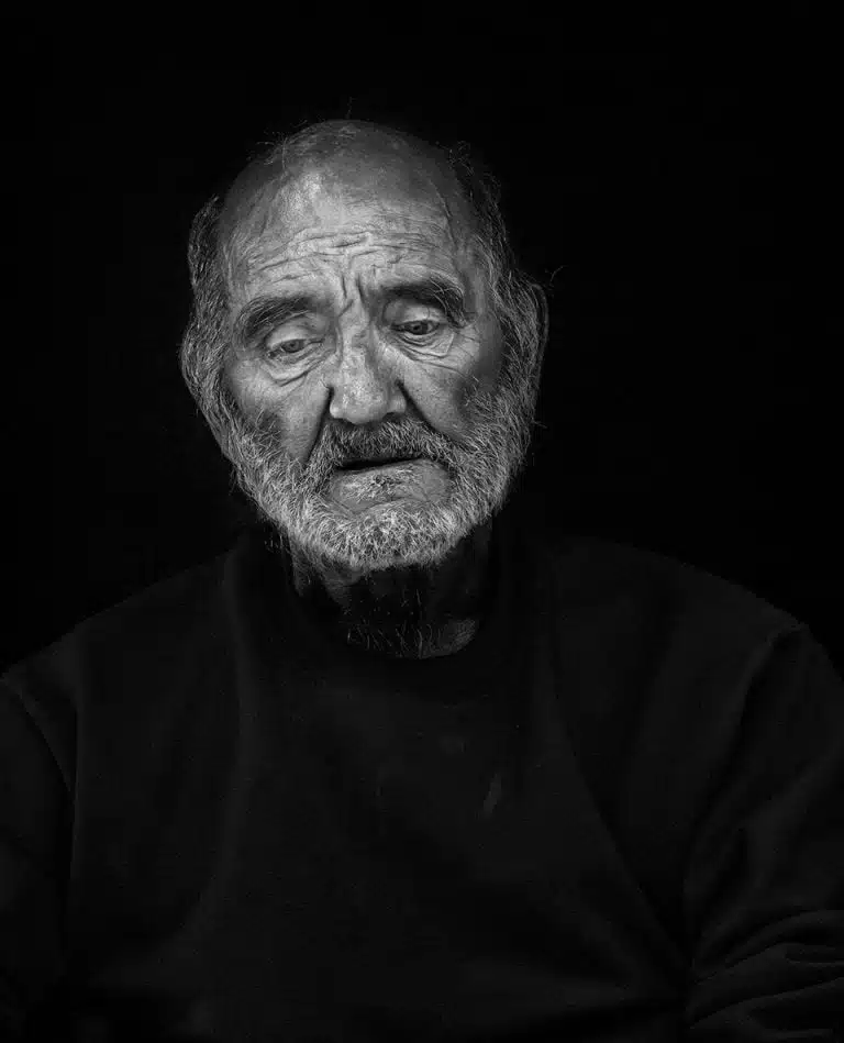 Faces_Photo_by John Gill-45 A black and white photo of an old man.