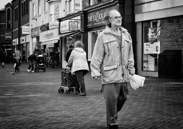 Redcar street photograph-12 A man walking down the street.