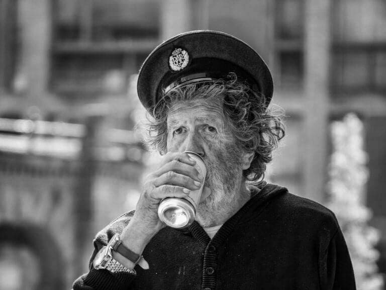 AUGUST Man drinking in the street