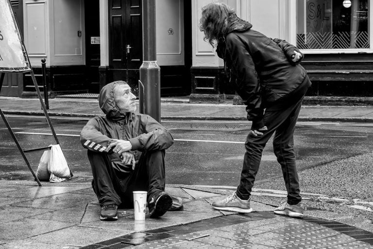 20230708-IMG_6994-Edit Black and white photo of a homeless man on the street.