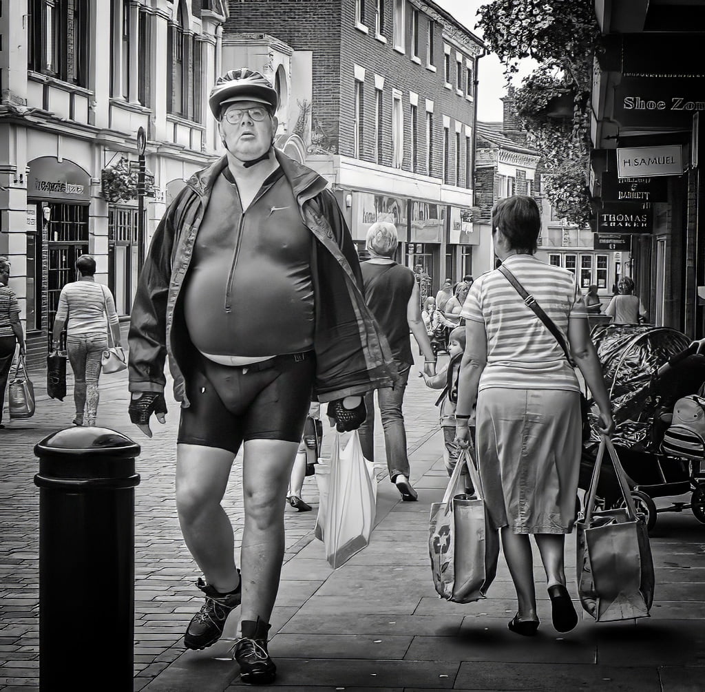 A man is walking down the street.
