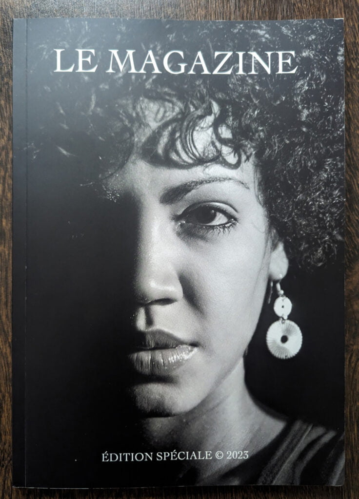 The cover of le magazine with an image of an afro haired woman.