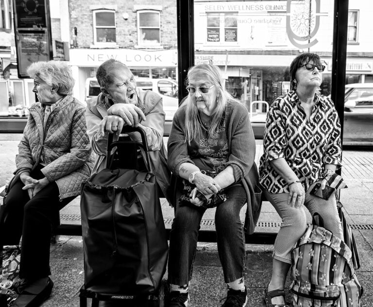 A group of people sitting on a bus.