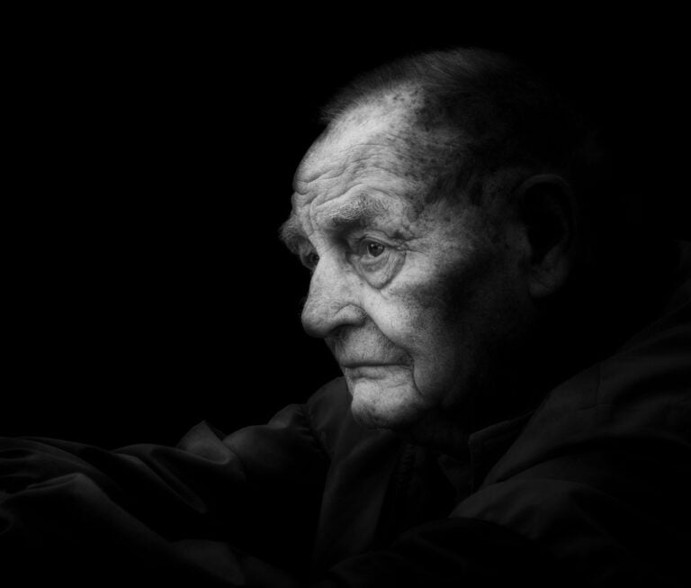 A black and white photo of an old man. A black and white photo of an old man.