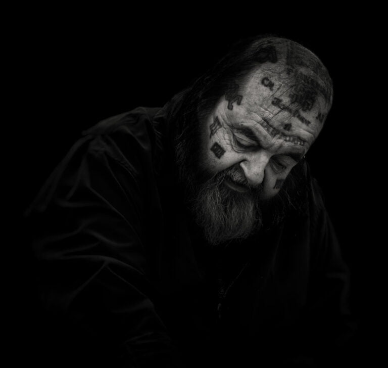A black and white photo of a man with a beard. A black and white photo of a man with a beard.