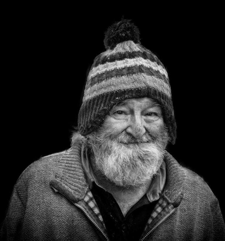 A black and white photo of a man with a beard. A black and white photo of a man with a beard.