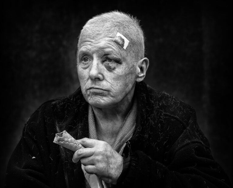 Black and white photo of an old man with a cigarette. Black and white photo of an old man with a cigarette.