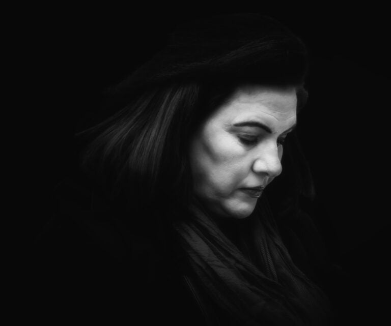 A black and white photo of a woman. A black and white photo of a woman.
