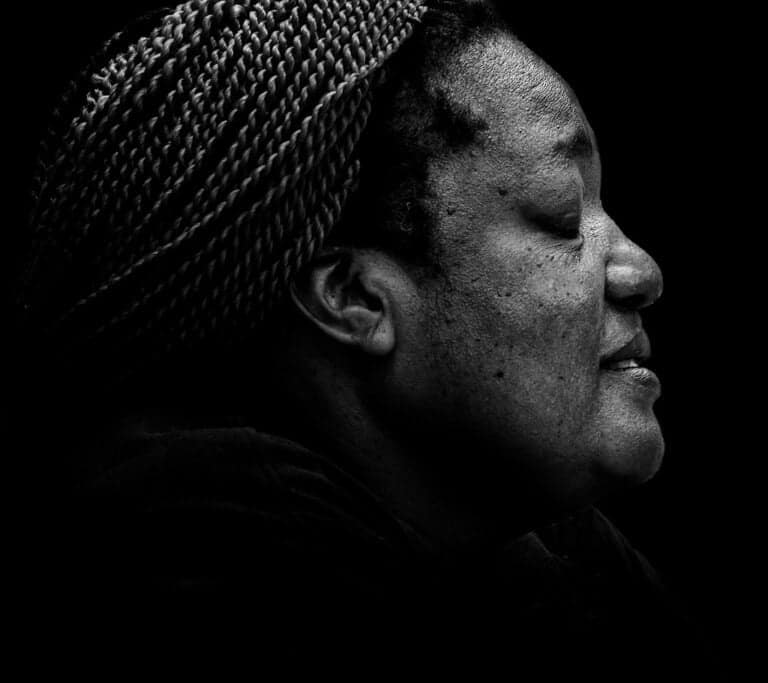 A black and white photo of a woman in a turban. A black and white photo of a woman in a turban.