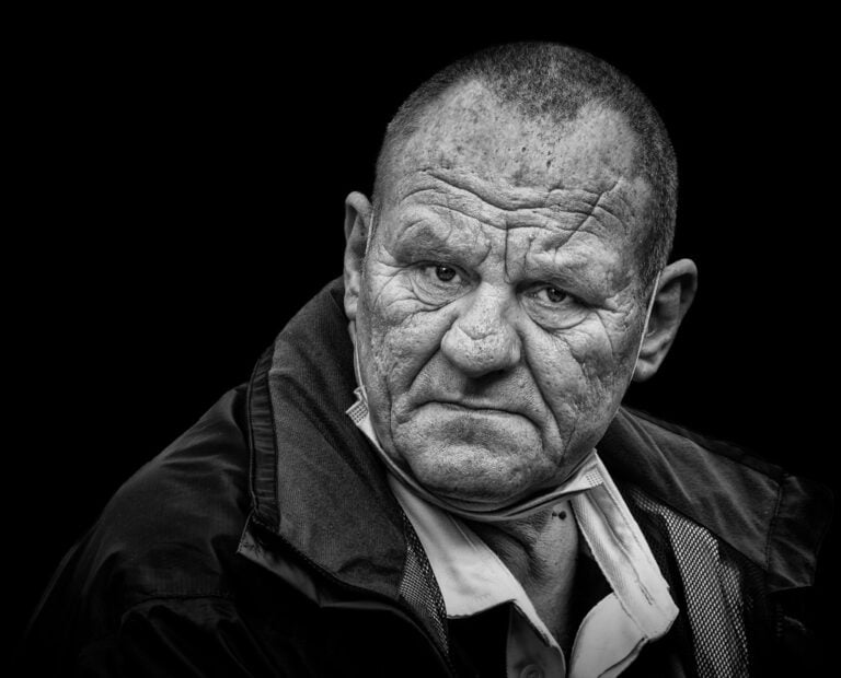 A black and white photo of an older man. A black and white photo of an older man.