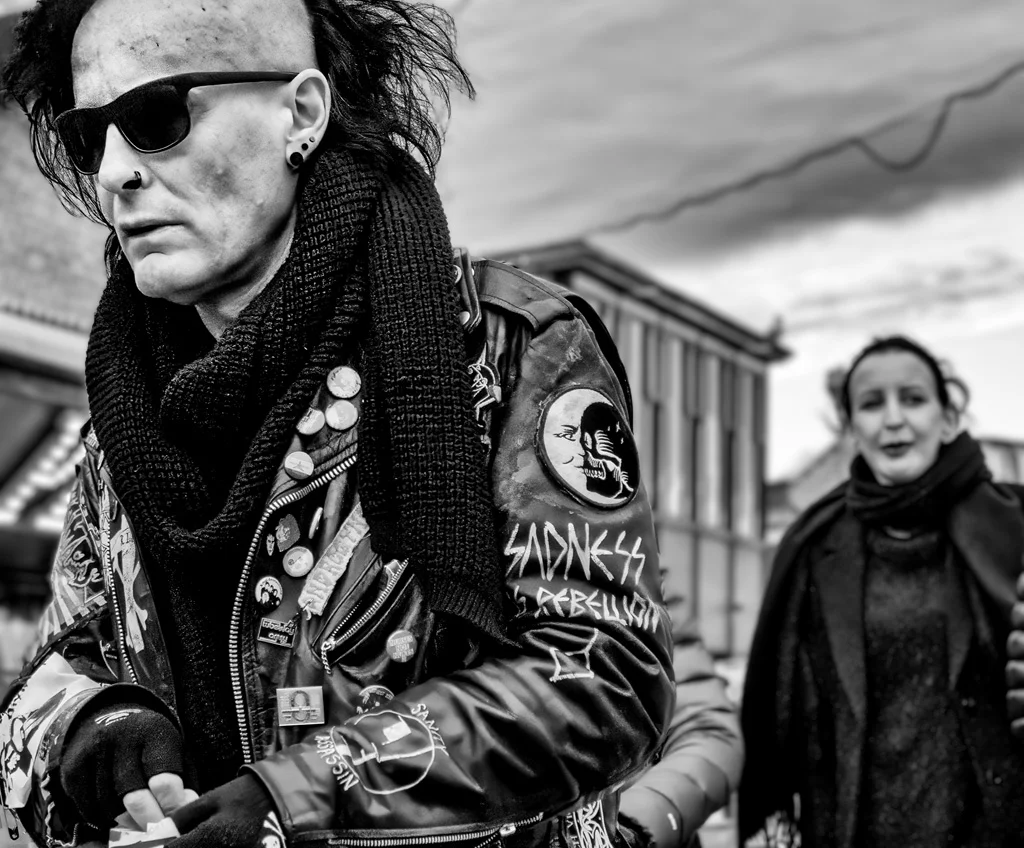 A black and white photo of a man in a leather jacket.
