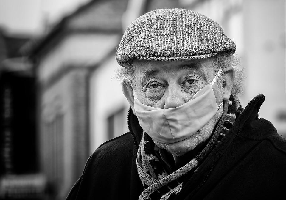 A man with a mask on his face.