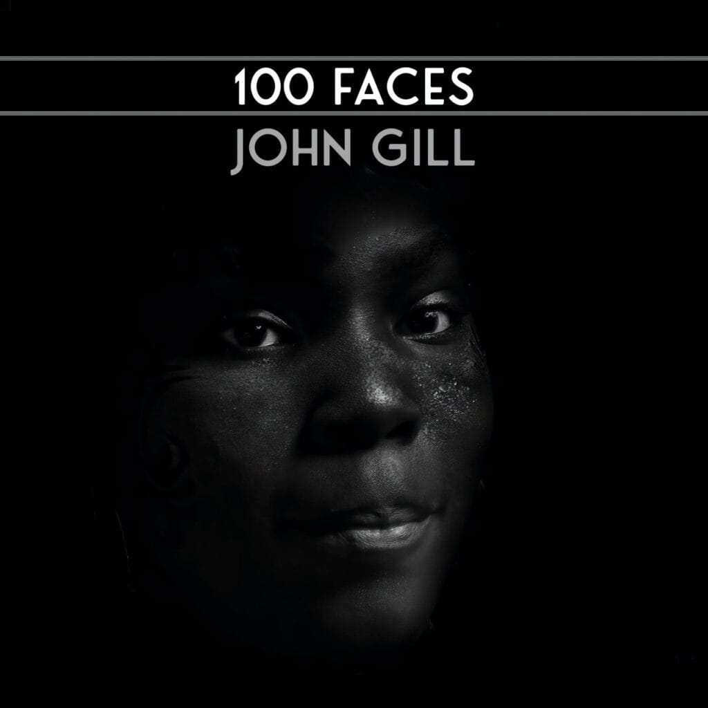 Book cover with the title “100 Faces” and author “John Gill” over a partially visible face of a person against a dark background.